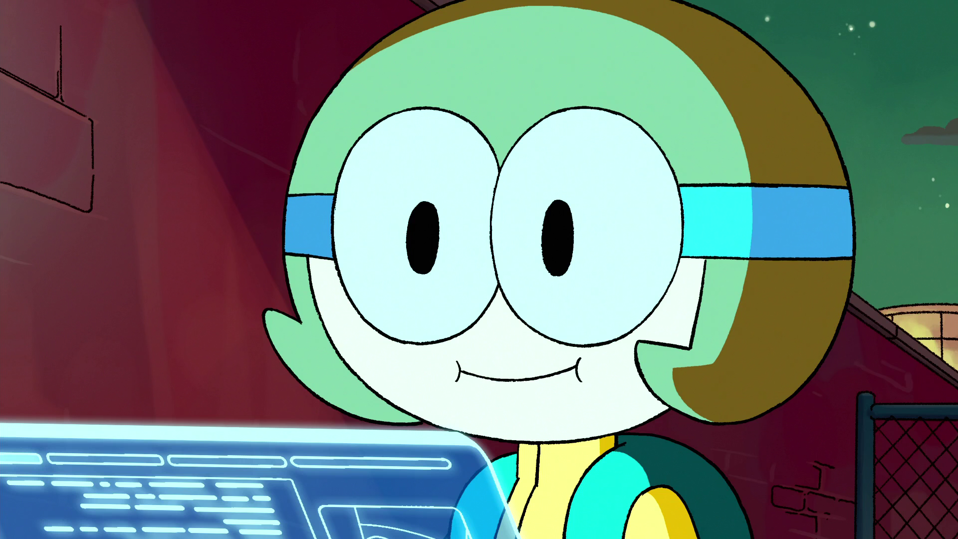 A screenshot from OK K.O. It shows a person whose got a yellow outfit with green straps, and big round scientist goggles around their eyes. Their brown hair is straight reaches the bottom of their head. They're looking up from their blue holographic screen, and is smiling!