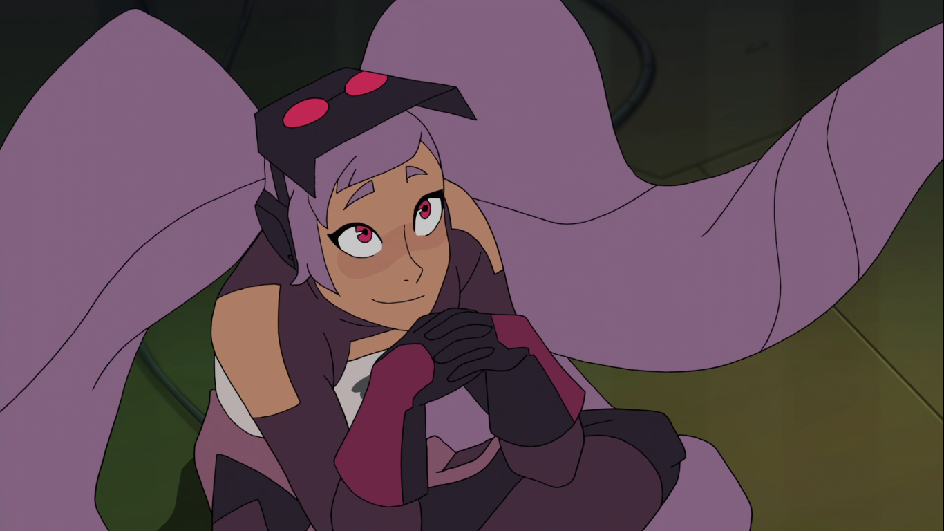 A screenshot from She-Ra and the Princesses of Power. It shows a girl with very long and wide purple twintails, red eyes, and smiling upwards. She has a futuristic purple & white outfit on, gloves, and a black welding mask with red-pink eyes.