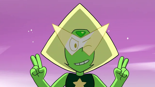 A screenshot from Steven Universe. It shows a girl with green skin, and wide + high yellow hair in a triangle shape. She's wearing a dark green shirt with a star in the middle, and a angular glasses that surpass the sides of her head. They're making two peace signs, smiling and winking.